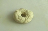 making the dough into a bagel