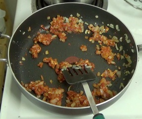 adding the tomato paste