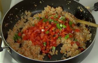adding red pepper and green onion