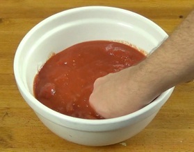 mixing the tomatoes