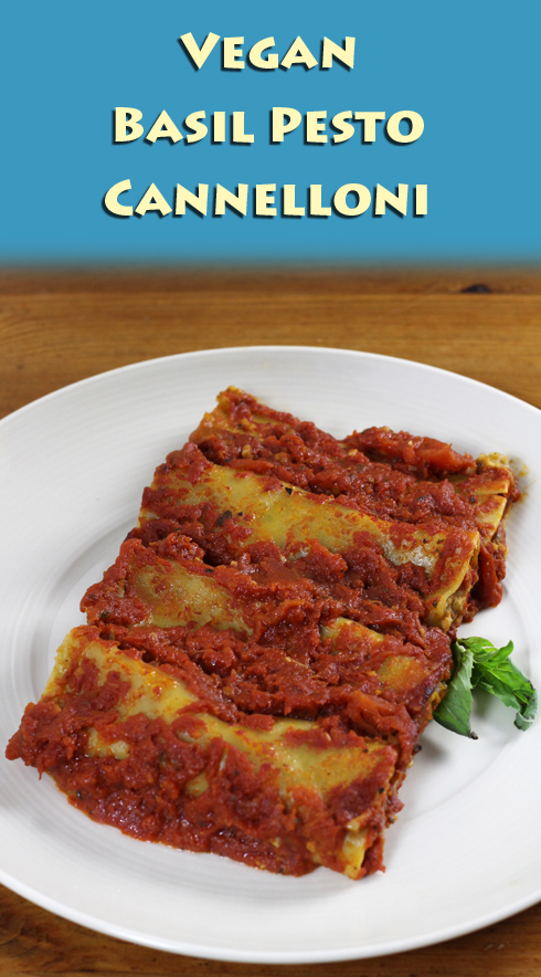 Vegan cannelloni with a basil pesto filling covered in homemade tomato sauce