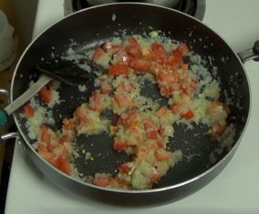 chopped tomato added to pan