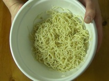 noodles coated in canola oil in a large bowl