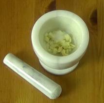 garlic and salt in a mortar and pestle