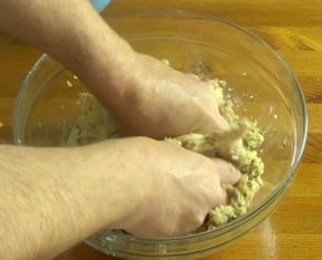 mixing the meatball ingredients by hand
