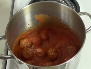 meatballs in a pot with marinara sauce