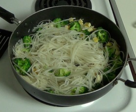 stir frying the noodles