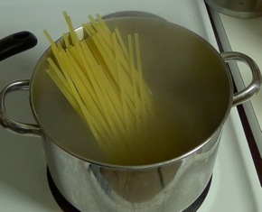 fettuccine added to boiling water