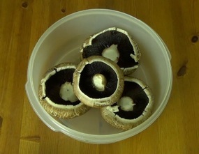 portobello mushrooms in a shallow dish