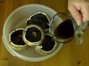 adding marinade to the mushrooms