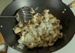 mushrooms added to wok