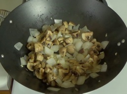 Stirfrying mushrooms and garlic