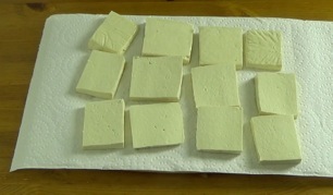 tofu slices on paper towel
