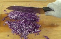chopping the cabbage slices crosswise
