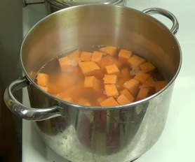 yam pieces, in a pot of water