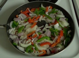 sauteeing onions and peppers