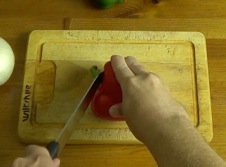 Removing the stem from a red pepper