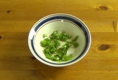 green onions and sesame oil in a bowl