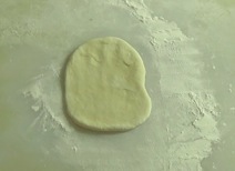 rolling dough into an oval