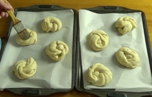 brushing buns with diluted maple syrup