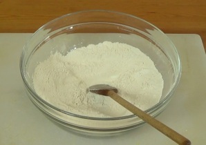 mixing dry ingredients in a large mixing bowl
