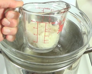 coconut butter in a mixing cup