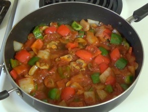 tomato sauce added to frying pan