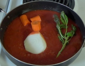 adding carrot, onion and fresh basil